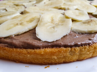 Preparation of chocolate banana cake. Creamy sponge cake,chocolate cake with banana slices,cake recipe.