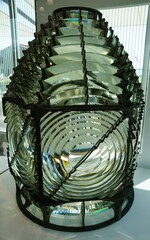 Detailed view of the lighthouse lens with the circular and layered design.