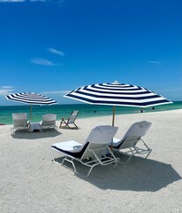 beach chairs and umbrella