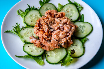 Red Salmon Fish With Cucumber and Salad Leaves