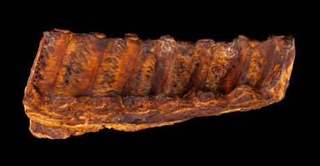 Smoked ribs isolated on black background.