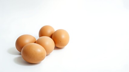 Fresh brown eggs on a white background, emphasizing simplicity and natural food.