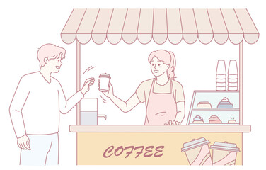 A customer approaches a lively coffee stand and buys a delightful cup from a friendly, smiling barista