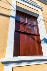 Detail of  facade of antique  house on historic center  of  Cambuy city, Minas Gerais state, Brazil