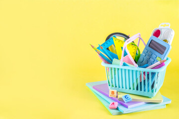 Back to school colorful background containing various school supplies, education accessories for...