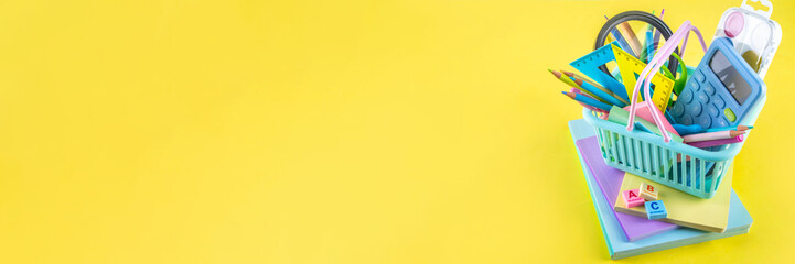 Back to school colorful background containing various school supplies, education accessories for...