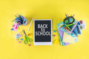 Back to school colorful background containing various school supplies, education accessories for...