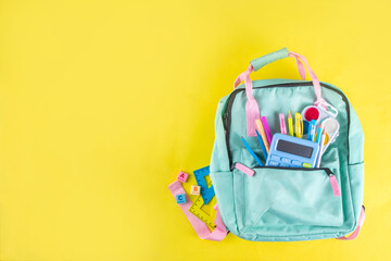 Back to school colorful background containing various school supplies, education accessories for...