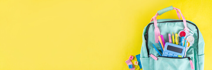 Back to school colorful background containing various school supplies, education accessories for...