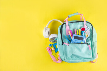 Back to school colorful background containing various school supplies, education accessories for...