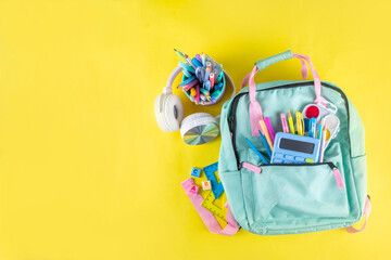 Back to school colorful background containing various school supplies, education accessories for...