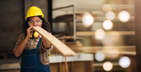 Carpentry Woman Wearing Safety Equipment Crafting Wood in Factory, African American Worker in...