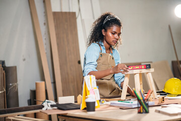 Craftsman Woman Working on Wood Design for Handmade Furniture in Factory Workshop with Focus on...