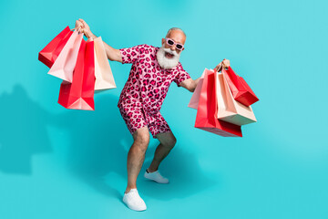 Full body photo of senior bearded man have fun enjoy shopping dressed stylish pink leopard print...