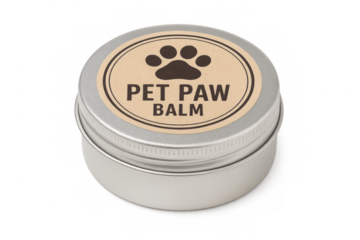 Round metal tin of pet paw balm with brown label on a transparent background