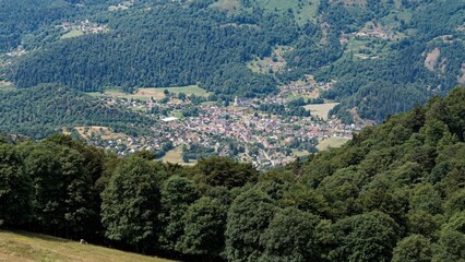View over the village of Kruth surrounded by forested hills, France