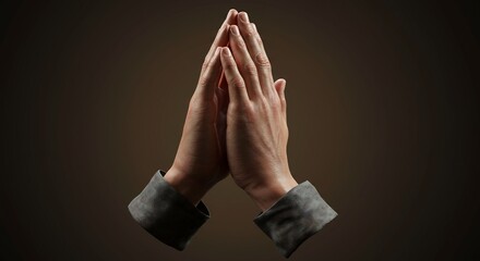 Two hands clasped together in prayer with visible cuffs against a dark warm background