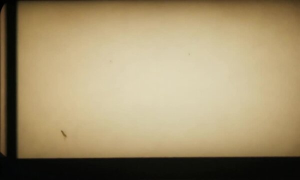 Old film frame with light leaks dust and scratches for vintage effect overlay and texture element