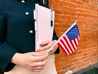 Woman with US flag and passport, symbol of travel, visa and immigration process
