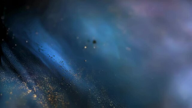 An abstract composition features a cascade of shimmering colors where vibrant blue and black hues meld together accentuated by scattered glitter particles. The focus is soft lending