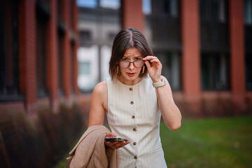 Surprised Businesswoman Looking Over Glasses