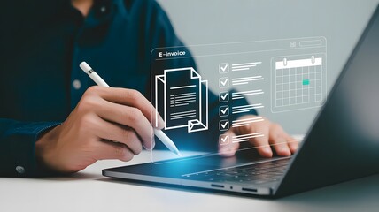A person signs an einvoice on a laptop, representing digital finance and online transactions