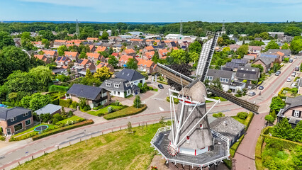 Aerial photo Dutch vintage windmill and turning blades. will take place mill is located in Twello village near Deventer in center of Holland. High quality photo