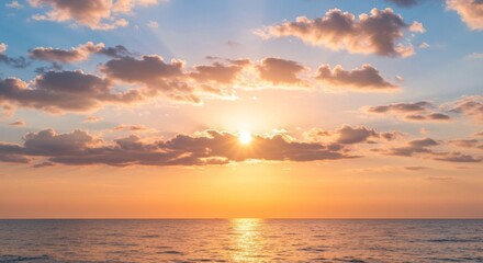 Fototapeta premium Golden Hour Sun Nestled Between Layered Clouds Above a Calm Sea