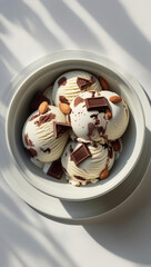 Rocky Road Gourmet Ice Cream Bowl with Chocolate Chunks and Almond Toppings: Artisanal Frozen Dessert for a Delicious Summer Indulgence - Perfect Gourmet Treat for Relaxing Summer Days