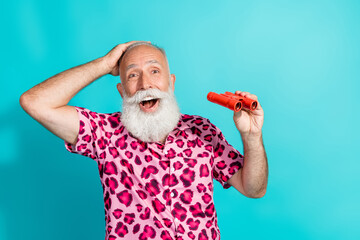 Photo of attractive senior bearded man excited watch binoculars dressed stylish pink leopard print...
