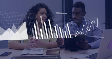 Analysts analyzing data overlay in business attire at office conference desk with laptop and tablet