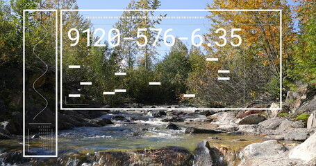 Flowing stream passing over rocks in mountain forest, with UI panel, code and binary digits