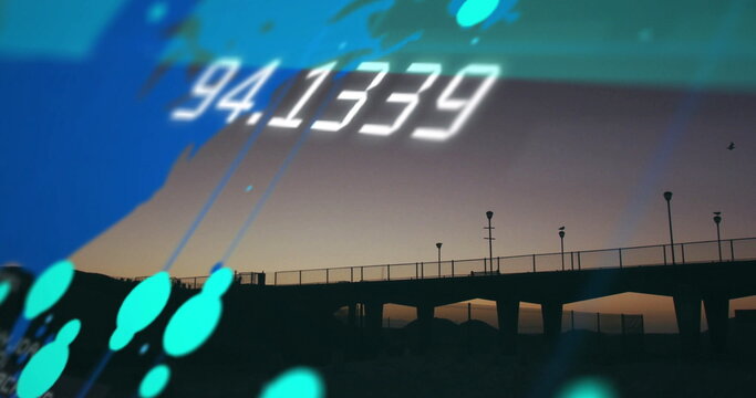 Floating white numeric display and teal shapes gliding over coastal pier at dusk, with lampposts