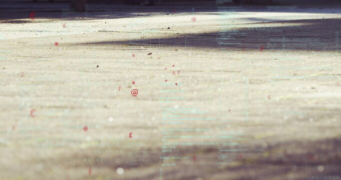 Hovering green code lines and red symbols drifting above outdoor courtyard pavement under sunlight - Powered by Adobe