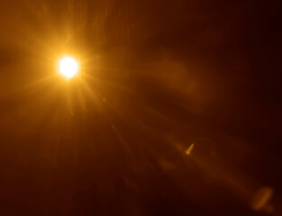 Light ray or sun beam background. Abstract light sparkle flash spotlight backdrop with golden...