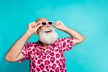 Photo of attractive senior bearded man look excited empty space dressed stylish pink leopard print...