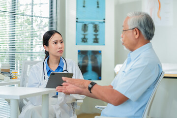 Senior man receives chiropractic neck adjustment for effective neck pain relief and injury rehabilitation. Professional chiropractor treats elderly patient suffering from chronic shoulder pain using o