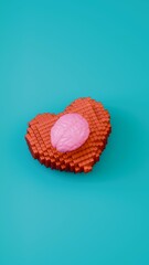 Glossy pink brain resting on red pixel heart against teal backdrop