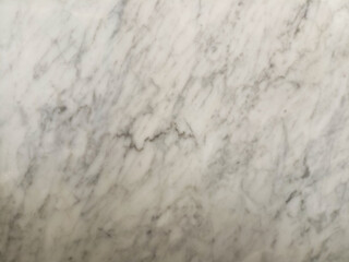 Cream marble texture with small speckles and subtle veins.

