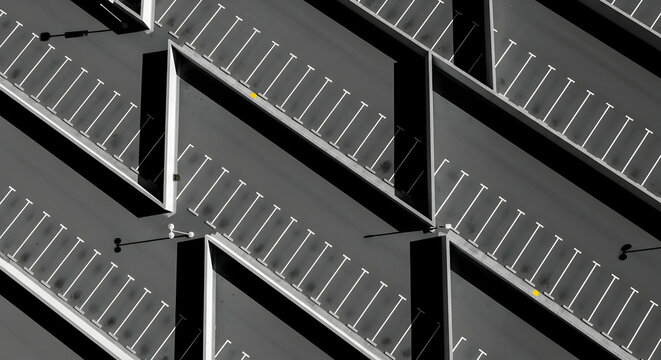 Aerial View Of Empty Parking Lot With Geometric Patterns And Abstract Forms
