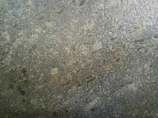 Gray granite texture with coarse black and white speckles.

