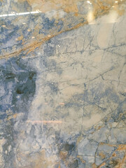 Fototapeta premium Blue stone texture with white and brown veins, resembling marble.