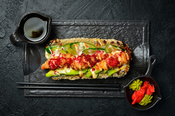 Fried Sushi roll with shrimp and cucumber. Brazilian style. Sushi Dog. Asian food.