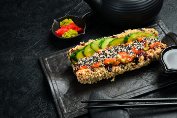 Fried Sushi roll with salmon and cucumber. Brazilian style. Sushi Dog.