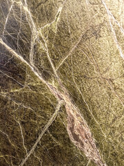 Green marble texture with white and gray veins, resembling natural patterns.

