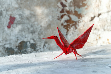 Red Origami Paper Crane on White Background – Traditional Japanese Art, Minimal Handmade Bird Figure, Peace and Zen Concept