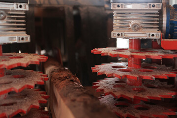 Metal gears. Woodworking machine close-up. Woodworking industry.