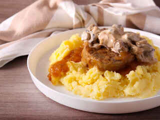 Roast veal tenderloin with gravy and mushroom sauce