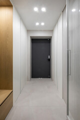The navy front door is stain-resistant, easy to maintain, and chic