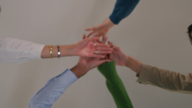 Teamwork concept with diverse hands joining together, Diverse hands in circle signify unity, teamwork, and partnership. Concept of collaboration. mix race people office teamwork success growth